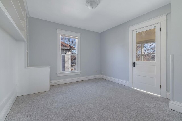 150 N Raynor Ave, Joliet, IL 60435 - carpeted empty room featuring baseboards