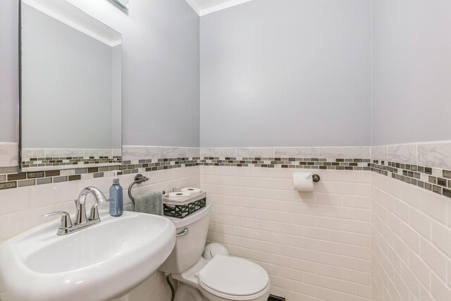 15246 S Millard Ave S, Midlothian, IL 60445 - half bath with tile walls and a wainscoted wall