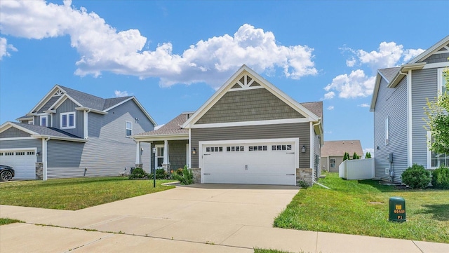 201 Cattail Ave, Savoy, IL 61874 - craftsman-style house featuring a front yard, an attached garage, concrete driveway, and stone siding