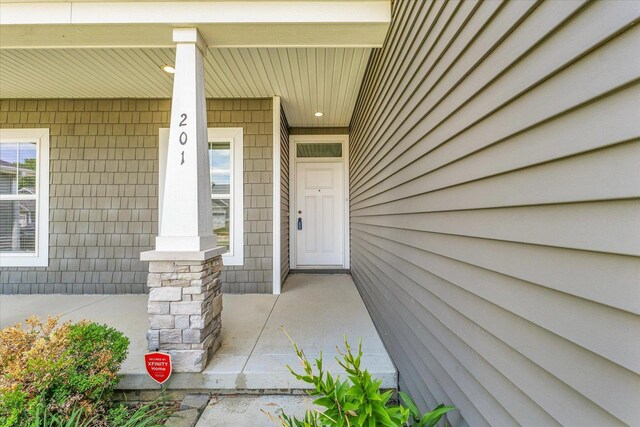 201 Cattail Ave, Savoy, IL 61874 - view of exterior entry with a porch