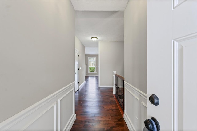 201 Cattail Ave, Savoy, IL 61874 - hall featuring an upstairs landing, dark wood finished floors, and a textured ceiling