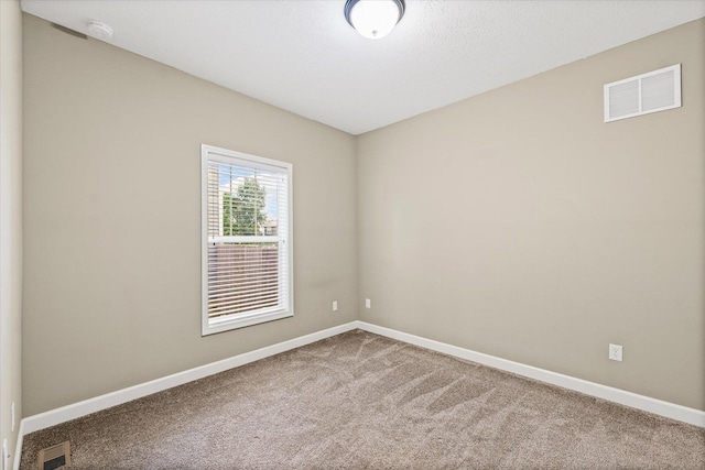 201 Cattail Ave, Savoy, IL 61874 - spare room featuring a smoke detector and carpet