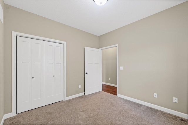 201 Cattail Ave, Savoy, IL 61874 - unfurnished bedroom with carpet flooring and a closet