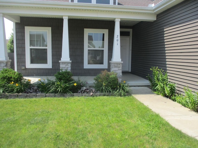 201 Cattail Ave, Savoy, IL 61874 - entrance to property featuring a porch and a yard