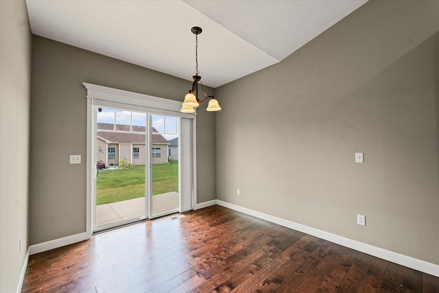 201 Cattail Ave, Savoy, IL 61874 - empty room with a chandelier and dark wood-type flooring