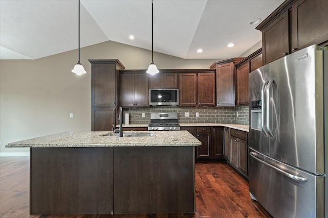 201 Cattail Ave, Savoy, IL 61874 - kitchen featuring stainless steel appliances, vaulted ceiling, dark brown cabinets, backsplash, and light stone countertops