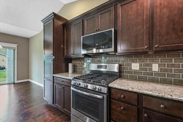 201 Cattail Ave, Savoy, IL 61874 - kitchen with appliances with stainless steel finishes, dark wood-type flooring, light stone countertops, backsplash, and dark brown cabinetry