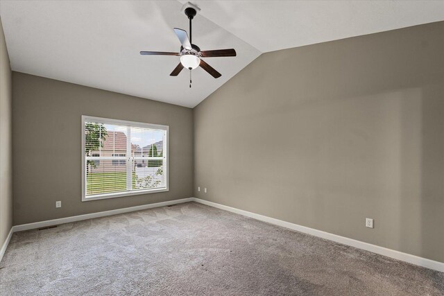 201 Cattail Ave, Savoy, IL 61874 - carpeted empty room featuring vaulted ceiling and ceiling fan