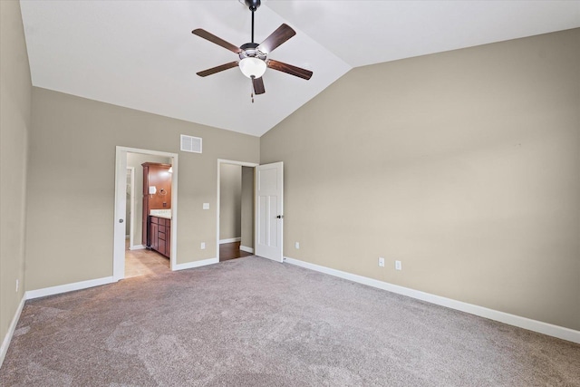 201 Cattail Ave, Savoy, IL 61874 - unfurnished bedroom with light carpet, connected bathroom, high vaulted ceiling, and a ceiling fan
