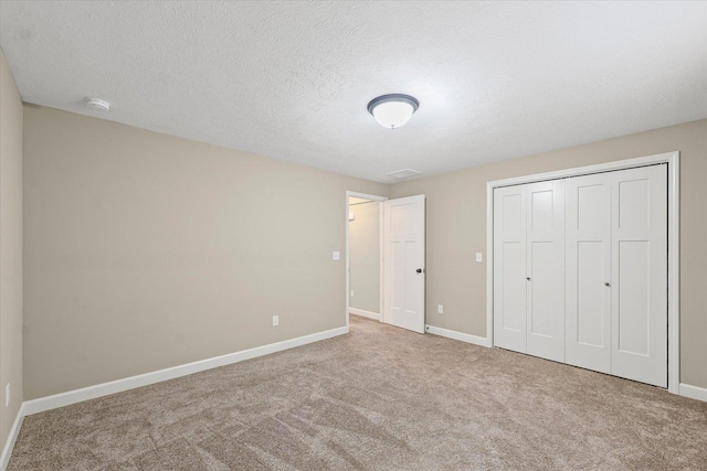 201 Cattail Ave, Savoy, IL 61874 - unfurnished bedroom featuring carpet flooring and a closet