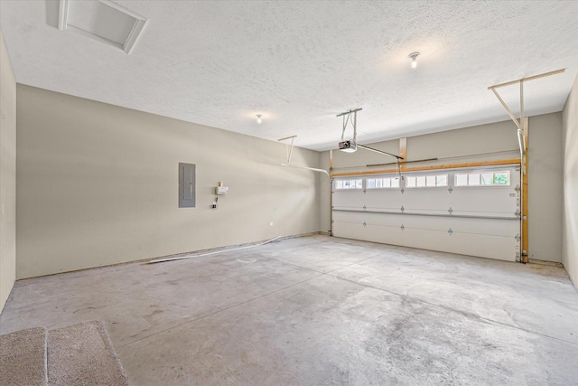 201 Cattail Ave, Savoy, IL 61874 - garage featuring electric panel and a garage door opener