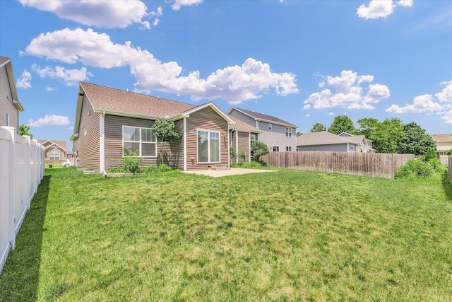 201 Cattail Ave, Savoy, IL 61874 - back of property with a fenced backyard, a patio area, and entry steps