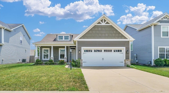 201 Cattail Ave, Savoy, IL 61874 - craftsman-style home with a front lawn, stone siding, a garage, and concrete driveway