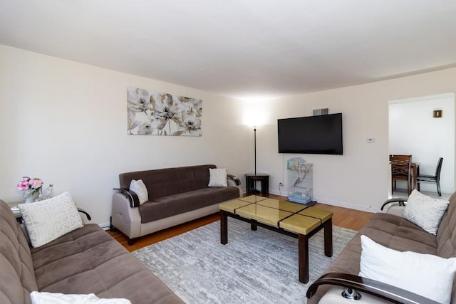8914 La Crosse Ave Unit 2S, Skokie, IL 60077 - living room featuring wood finished floors and baseboards