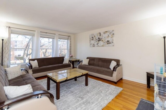 8914 La Crosse Ave Unit 2S, Skokie, IL 60077 - living room featuring light wood-style floors and baseboards