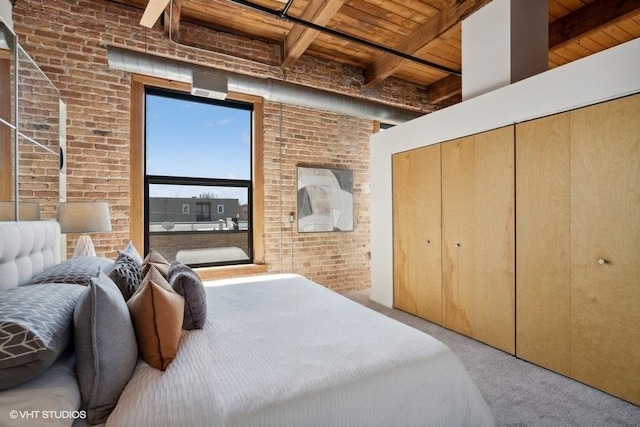 2511 W Moffat St Unit 305-D, Chicago, IL 60647 - carpeted bedroom featuring a wooden ceiling with exposed beams and brick wall