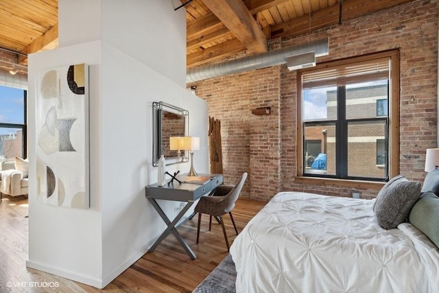2511 W Moffat St Unit 305-D, Chicago, IL 60647 - bedroom with a wood ceiling with exposed beams, brick wall, and wood finished floors
