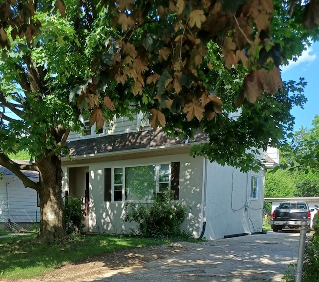 555 Lorraine Ave, Waukegan, IL 60085 - view of front of property with stucco siding and driveway