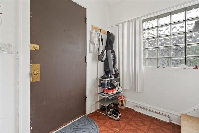 555 Lorraine Ave, Waukegan, IL 60085 - entryway with a baseboard heating unit and baseboards