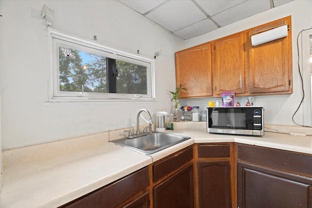 555 Lorraine Ave, Waukegan, IL 60085 - kitchen featuring stainless steel microwave, light countertops, and a drop ceiling