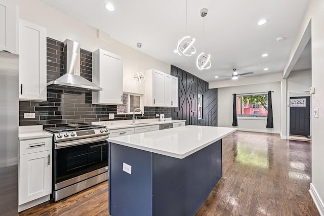 6547 S Langley Ave, Chicago, IL 60637 - kitchen featuring appliances with stainless steel finishes, wall chimney range hood, decorative backsplash, a center island, and dark wood-type flooring