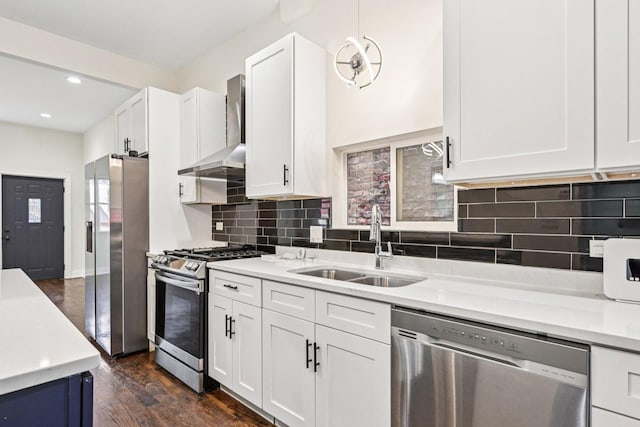 6547 S Langley Ave, Chicago, IL 60637 - kitchen with stainless steel appliances, wall chimney exhaust hood, light countertops, dark wood-type flooring, and white cabinets