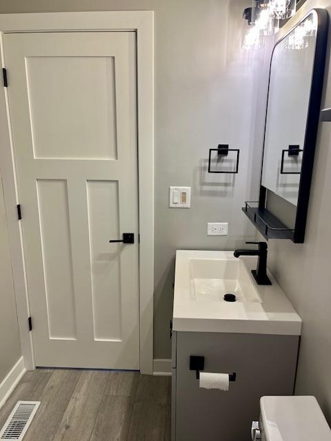 3105 Fox Hill Rd, Aurora, IL 60504 - bathroom with wood finished floors and vanity