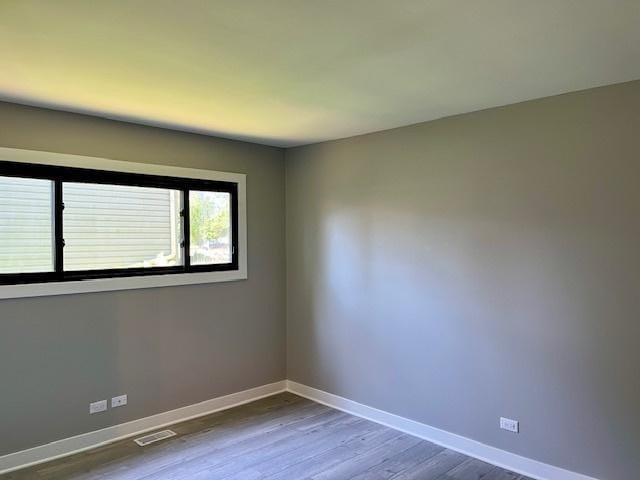 3105 Fox Hill Rd, Aurora, IL 60504 - spare room featuring baseboards and dark wood-style flooring