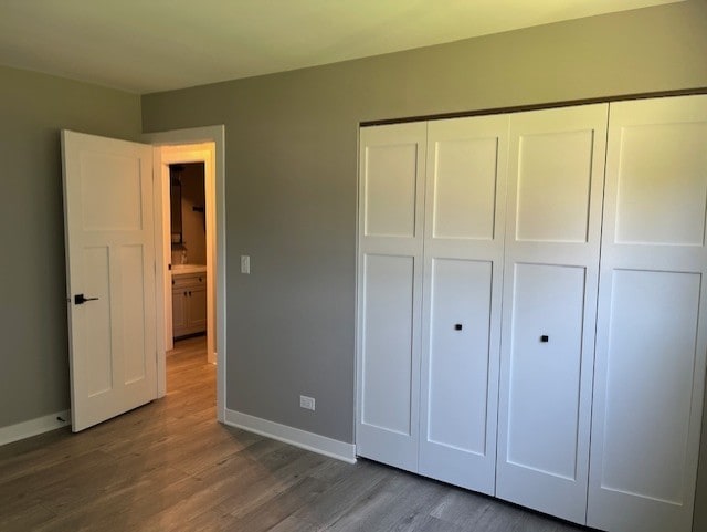 3105 Fox Hill Rd, Aurora, IL 60504 - unfurnished bedroom featuring wood finished floors and a closet