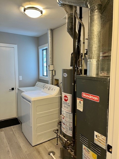 3105 Fox Hill Rd, Aurora, IL 60504 - laundry room with light wood finished floors, independent washer and dryer, water heater, and heating unit