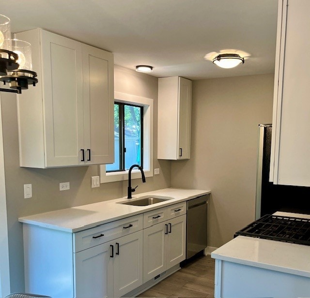 3105 Fox Hill Rd, Aurora, IL 60504 - kitchen with dishwasher, light countertops, light wood-type flooring, and white cabinetry