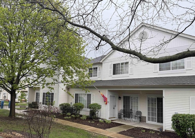 133 Heather Glen Dr Unit 133, Aurora, IL 60504 - view of front of home featuring a patio area and roof with shingles