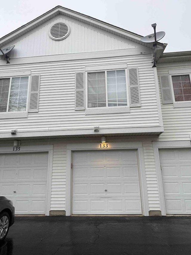 133 Heather Glen Dr Unit 133, Aurora, IL 60504 - garage featuring asphalt driveway