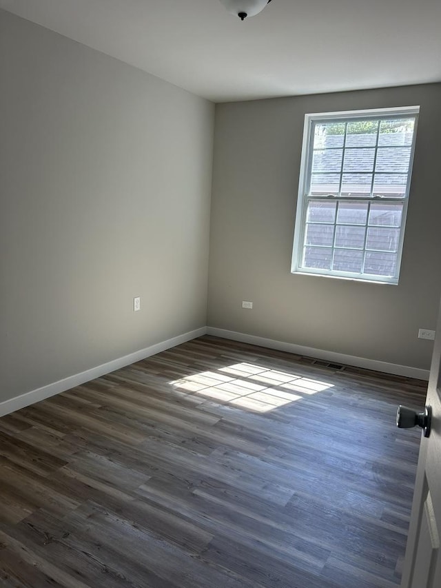 5309 Cleveland Dr, Mchenry, IL 60050 - empty room featuring dark wood finished floors and baseboards