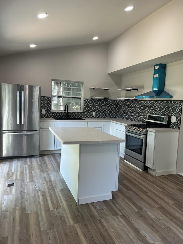 5309 Cleveland Dr, Mchenry, IL 60050 - kitchen featuring appliances with stainless steel finishes, ventilation hood, wood finished floors, tasteful backsplash, and recessed lighting