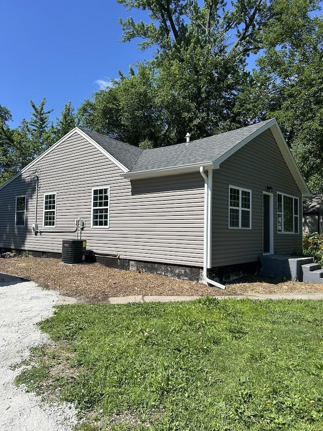 5309 Cleveland Dr, Mchenry, IL 60050 - view of home's exterior featuring a lawn and a shingled roof