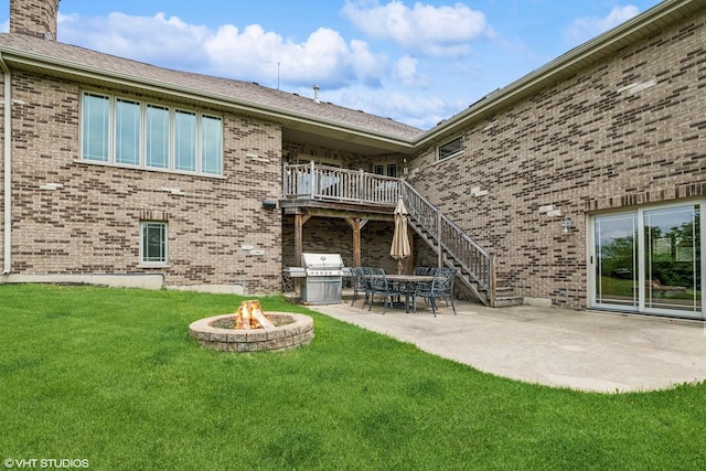 9265 Maura Ct, Frankfort, IL 60423 - rear view of house with an outdoor fire pit, brick siding, a yard, and stairway