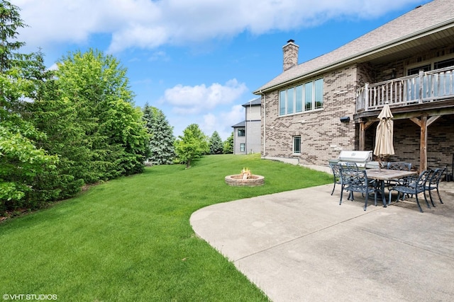 9265 Maura Ct, Frankfort, IL 60423 - view of grassy yard with a fire pit, a balcony, a patio area, and outdoor dining space