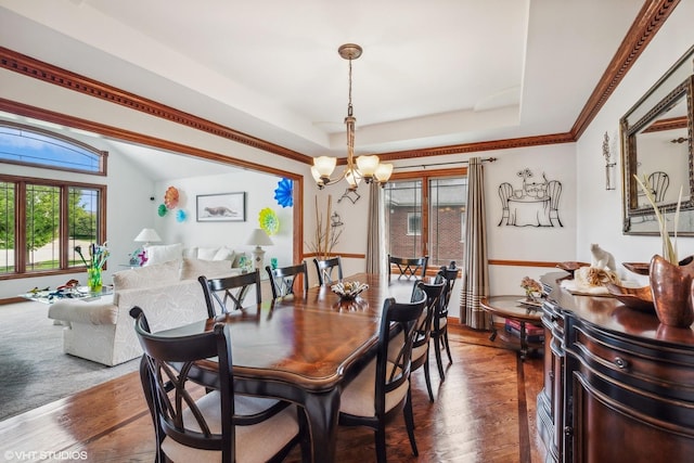 9265 Maura Ct, Frankfort, IL 60423 - dining room featuring a chandelier, plenty of natural light, a raised ceiling, and dark wood-type flooring