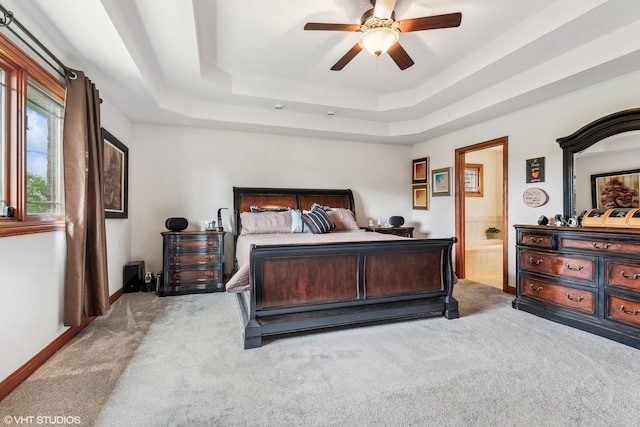 9265 Maura Ct, Frankfort, IL 60423 - bedroom featuring light colored carpet, a raised ceiling, ensuite bathroom, and a ceiling fan