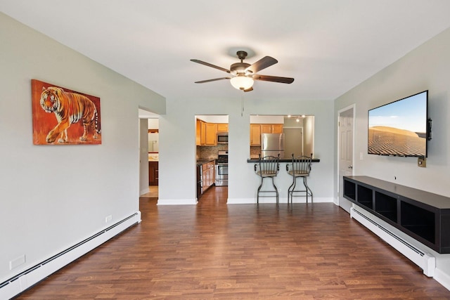 493 Mchenry Rd Unit 1B, Wheeling, IL 60090 - unfurnished living room with baseboard heating, ceiling fan, and dark wood-style floors