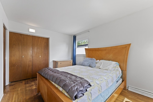 381 N 4th Ave Unit B, Des Plaines, IL 60016 - bedroom featuring baseboard heating, wood finished floors, and a closet