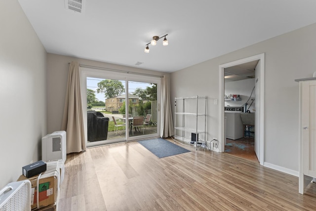 381 N 4th Ave Unit B, Des Plaines, IL 60016 - spare room with washer / dryer and wood finished floors