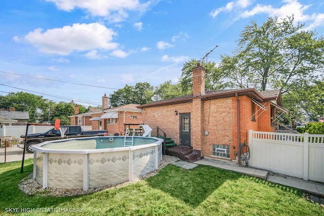 11258 S Trumbull Ave S, Chicago, IL 60655 - rear view of property featuring brick siding and a chimney