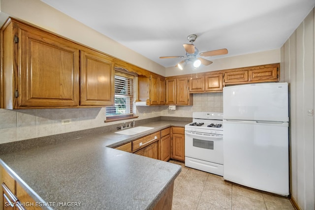 11258 S Trumbull Ave S, Chicago, IL 60655 - kitchen featuring white appliances, brown cabinetry, dark countertops, and ceiling fan