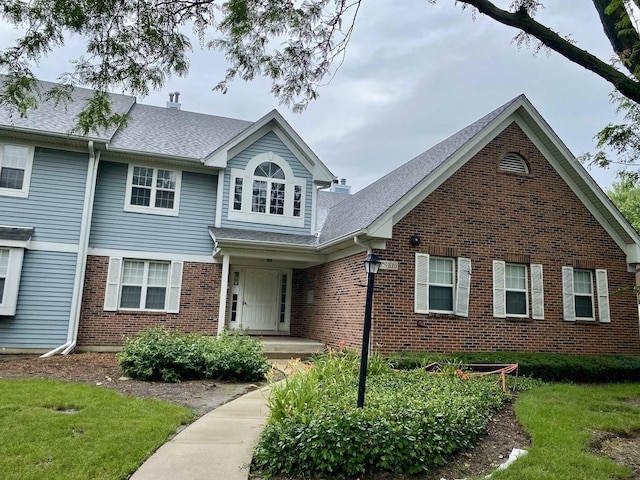 5S510 Scots Dr Unit G, Naperville, IL 60563 - traditional-style home with brick siding and roof with shingles