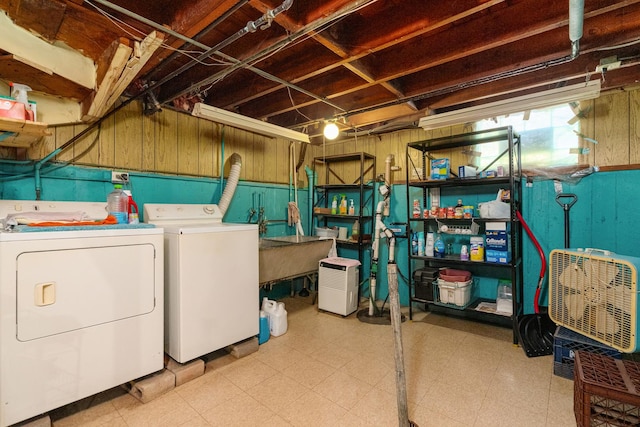 2551 Elm St, River Grove, IL 60171 - laundry area featuring washing machine and dryer, tile patterned floors, and wooden walls