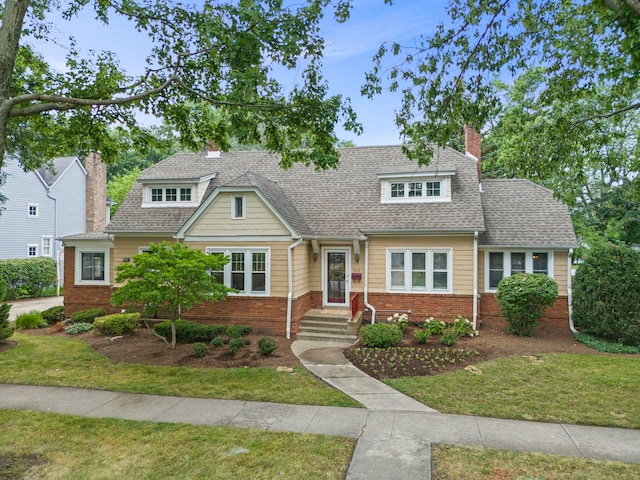 260 N Charlotte St, Lombard, IL 60148 - view of front of house featuring brick siding, a chimney, a front lawn, and a shingled roof