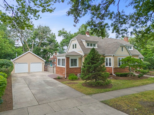 260 N Charlotte St, Lombard, IL 60148 - view of front facade featuring an outbuilding, a detached garage, brick siding, and a chimney