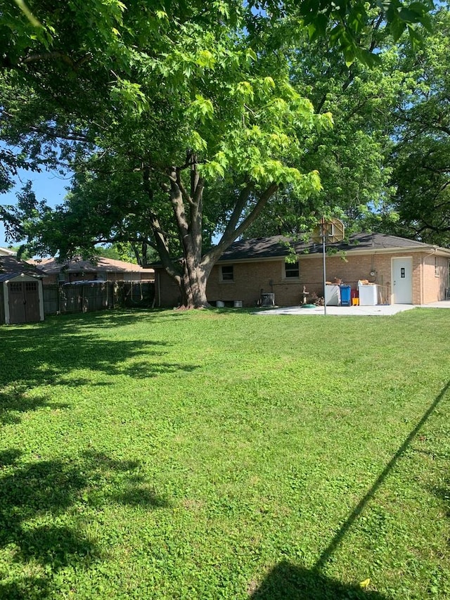 6425 W 83rd Pl, Burbank, IL 60459 - view of yard featuring a storage shed and a patio area